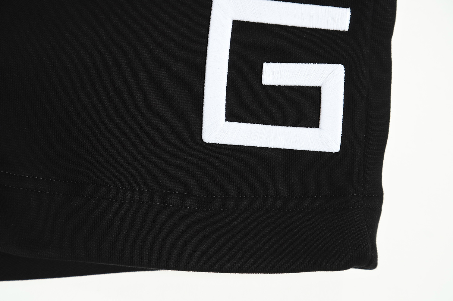 Givenchy four grid embroidery logo shorts