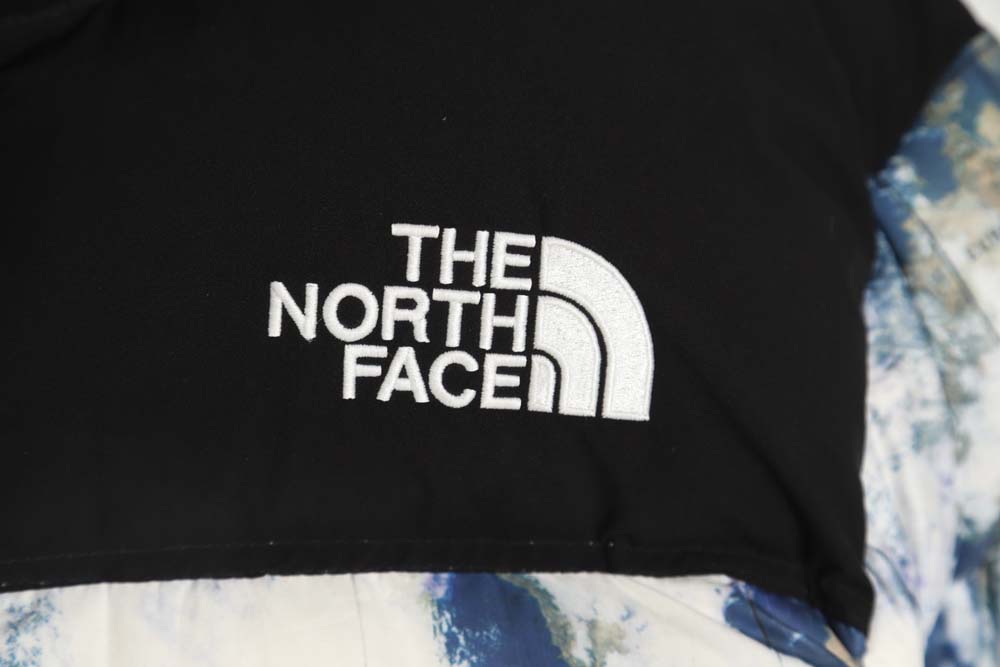 the nor*h f**e t*f nor*h f**e nuptse 1996 large plaid earth print down jacket