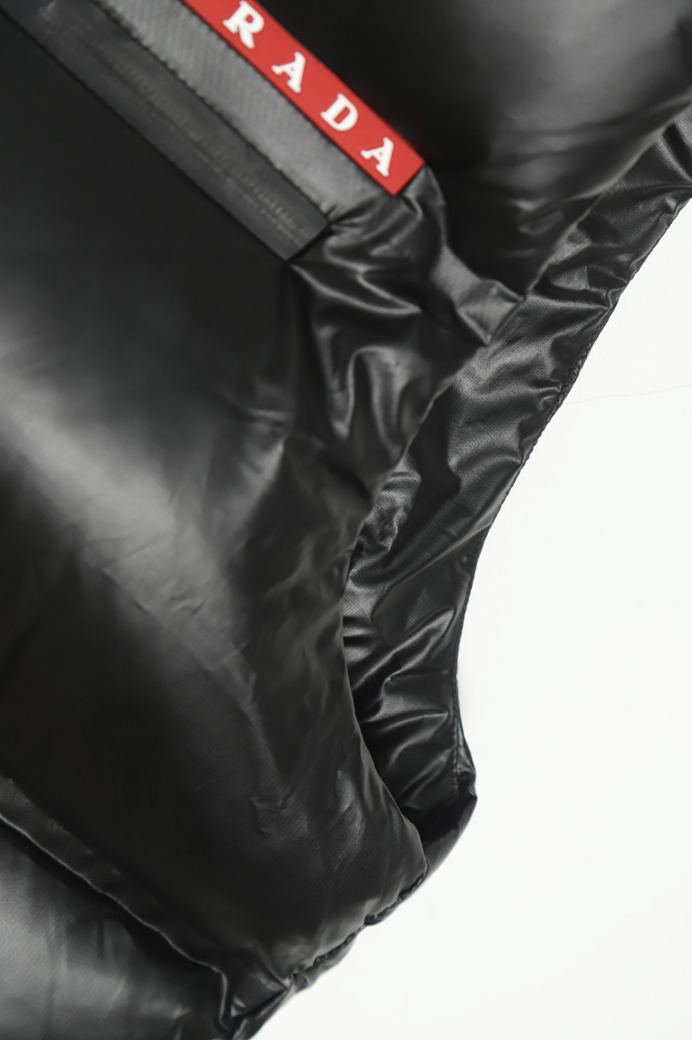 Pra*a red stripe logo down vest