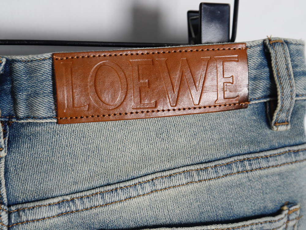 L0ew* glitch style embroidered logo jeans