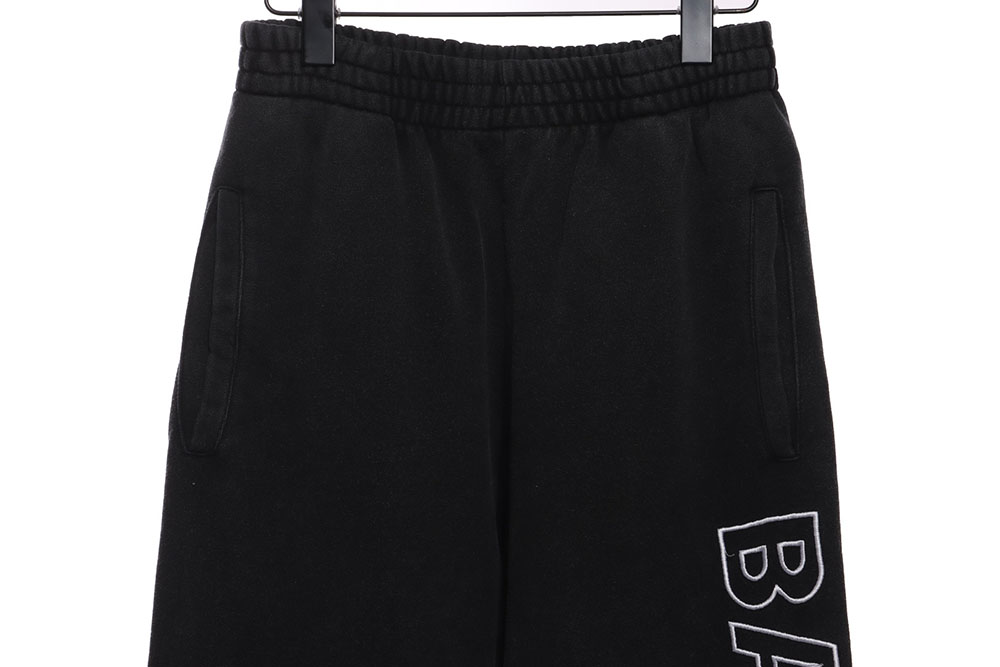 Ba*len*cia*ga distressed washed monogram trousers