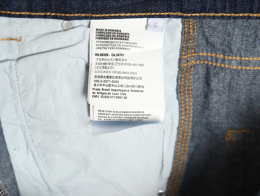 Pra*a denim shorts with triangle logo