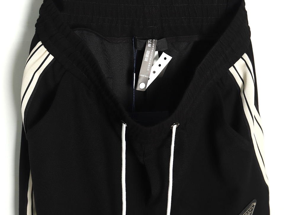 Pra*a triangle logo iron ribbon trousers