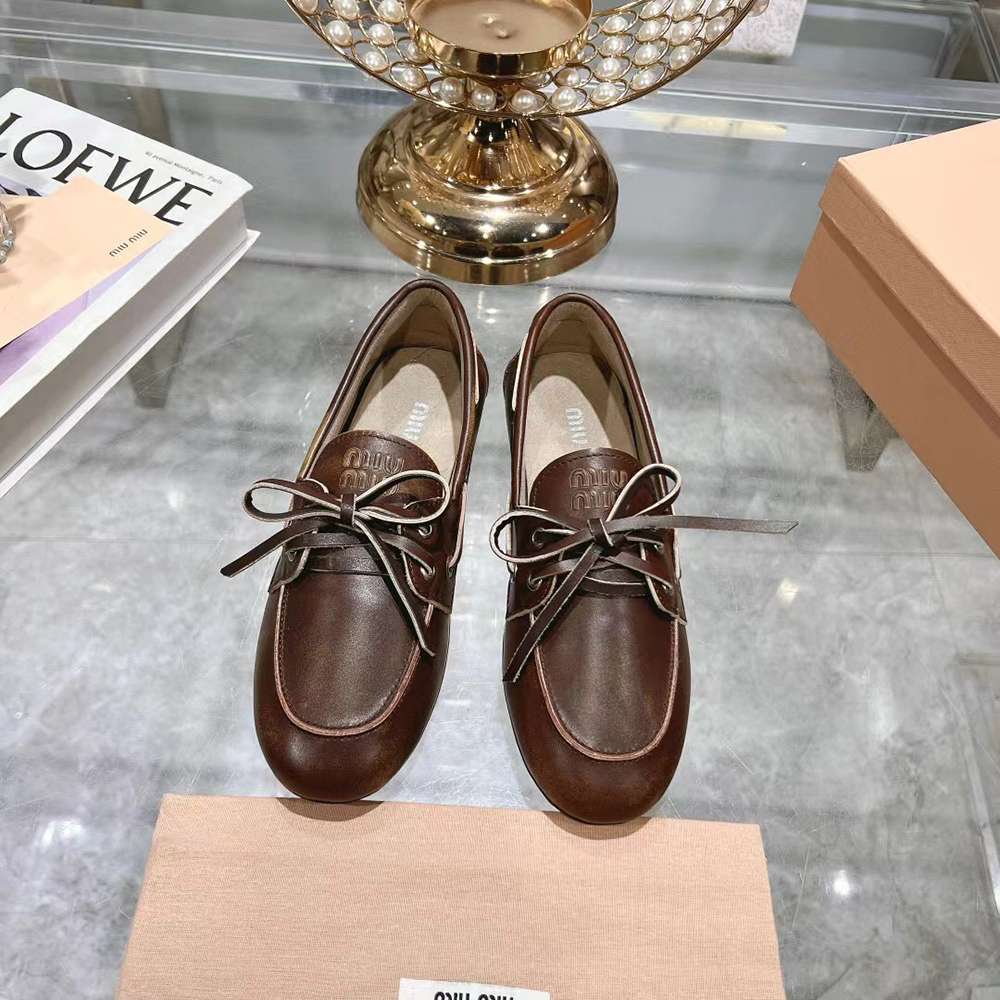 Miu Miu bleached leather loafers