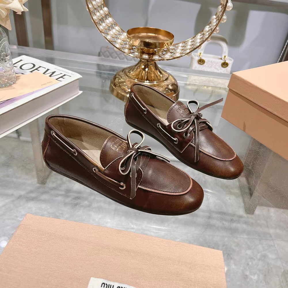 Miu Miu bleached leather loafers