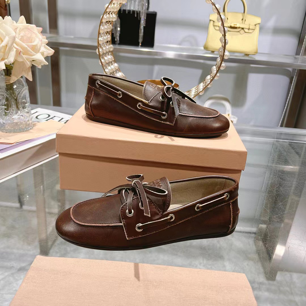 Miu Miu bleached leather loafers