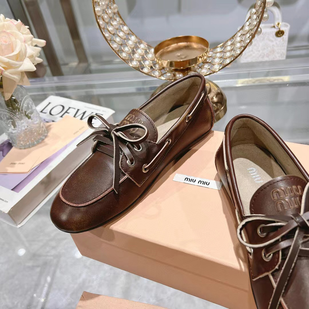 Miu Miu bleached leather loafers