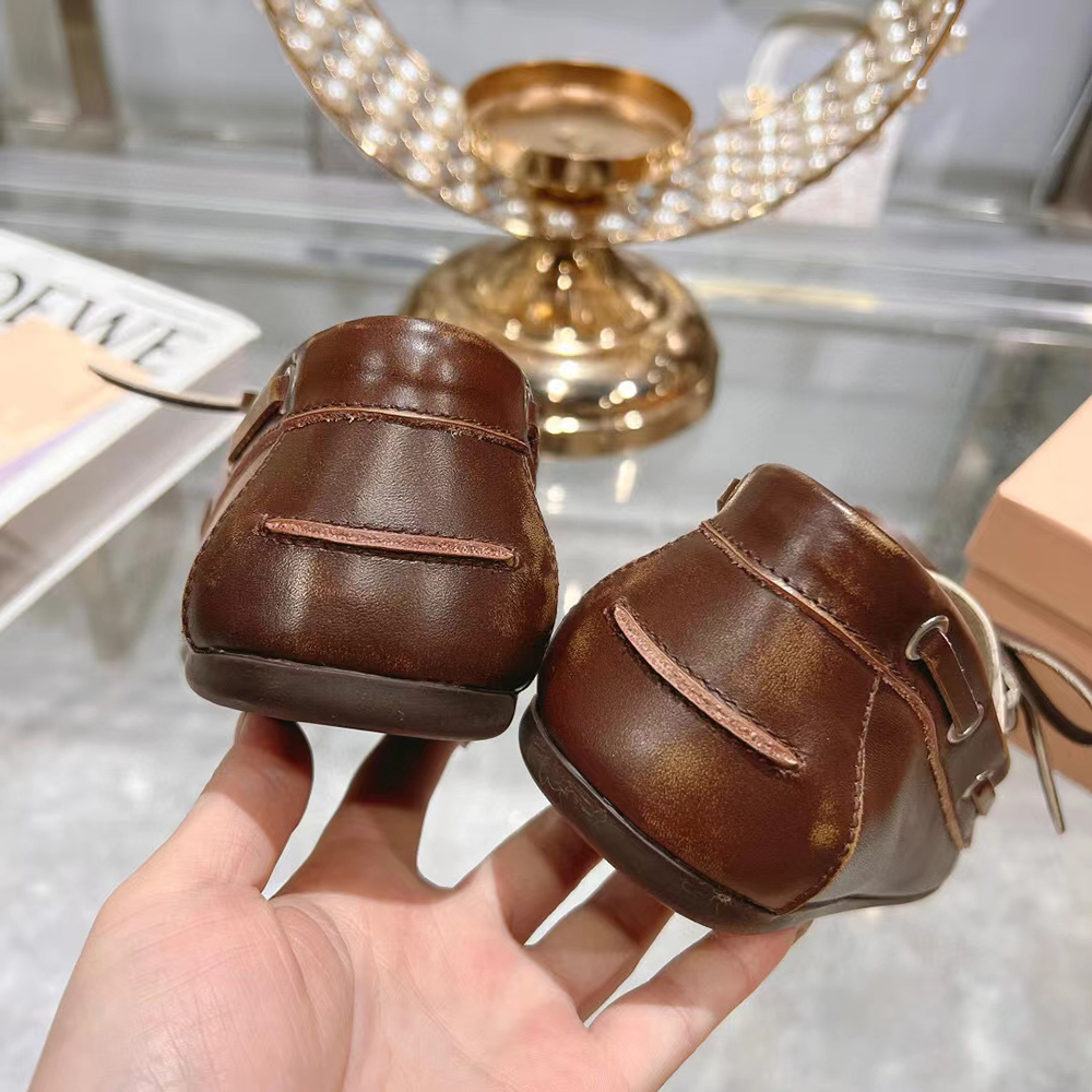 Miu Miu bleached leather loafers