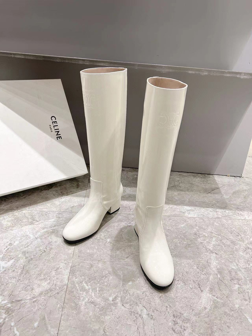 Ce**e triomphe high boot in patent calfskin