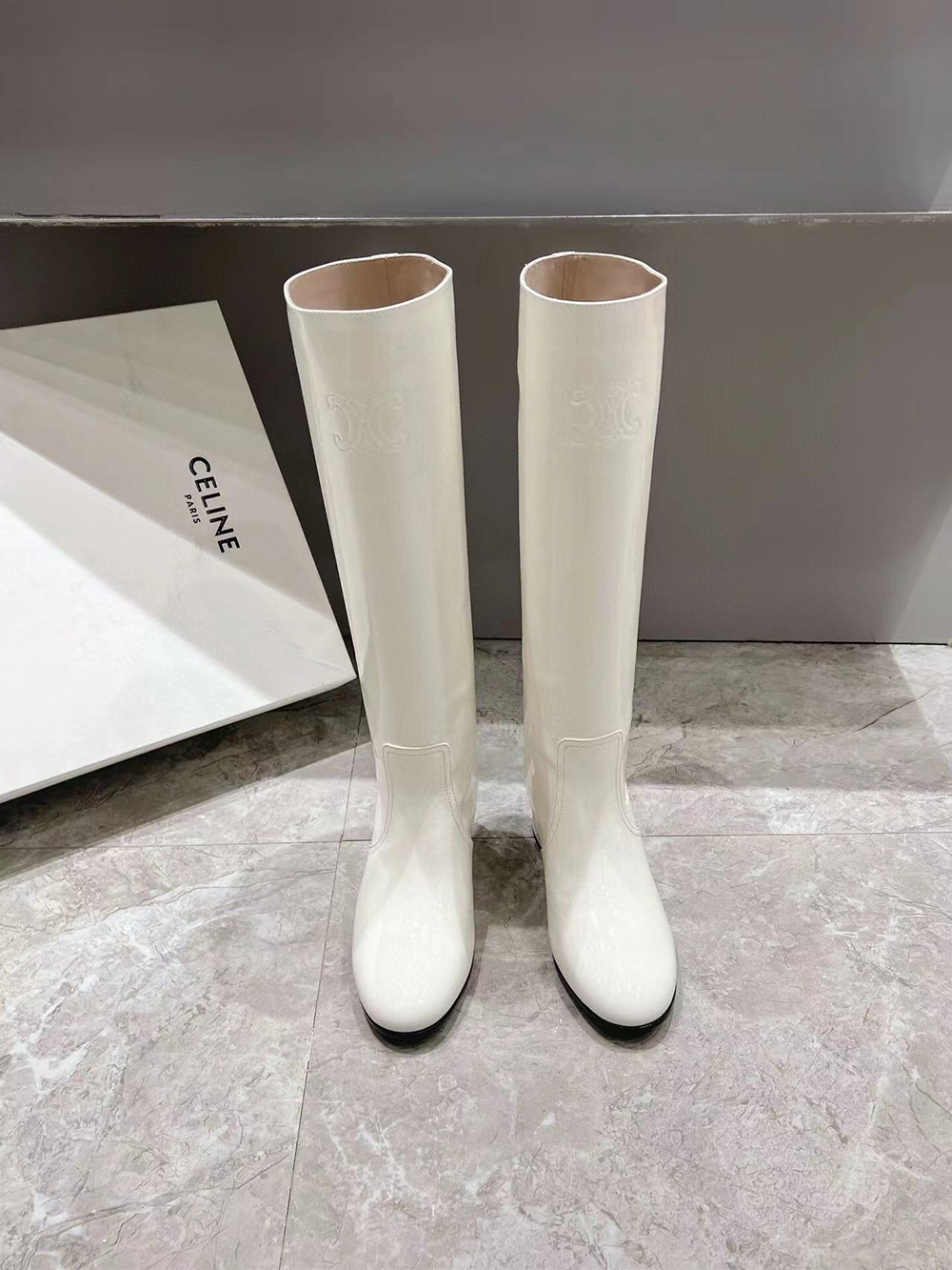 Ce**e triomphe high boot in patent calfskin