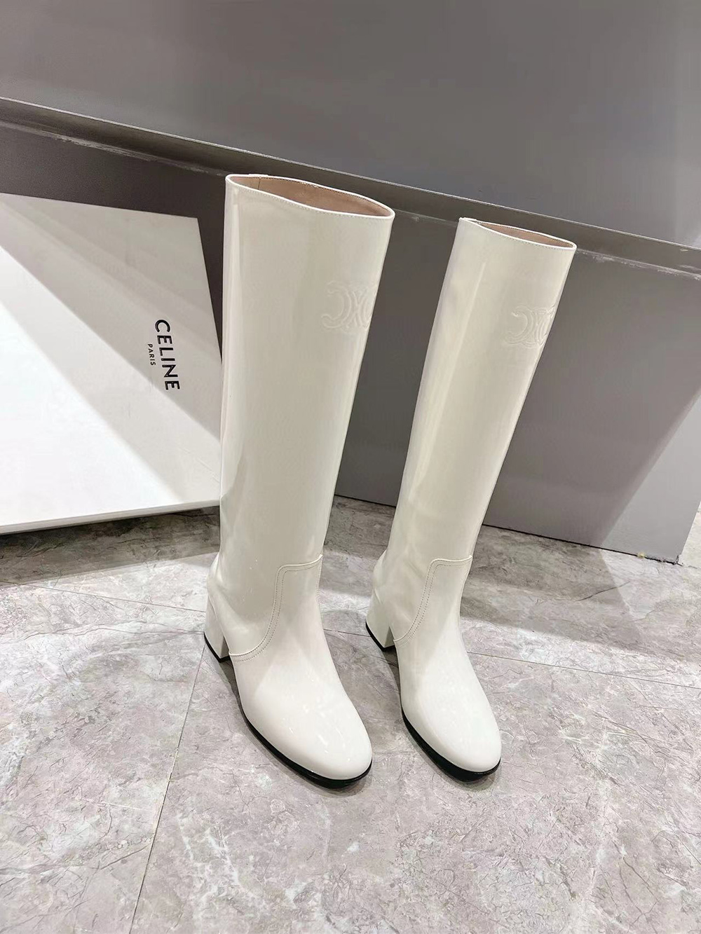 Ce**e triomphe high boot in patent calfskin