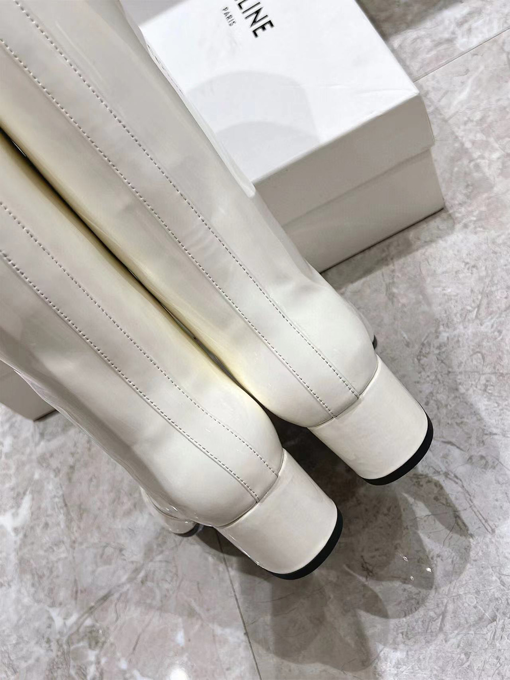 Ce**e triomphe high boot in patent calfskin