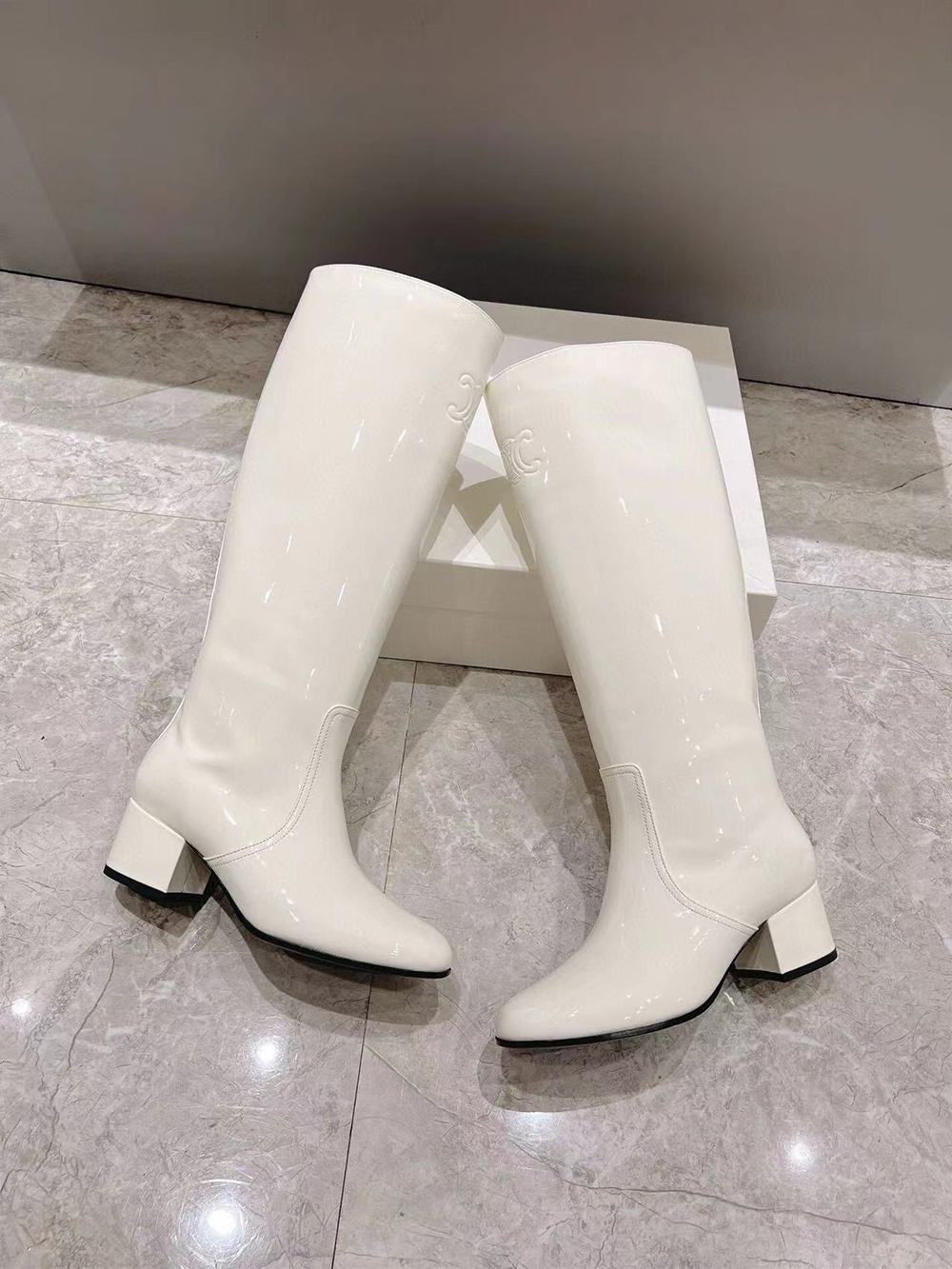 Ce**e triomphe high boot in patent calfskin