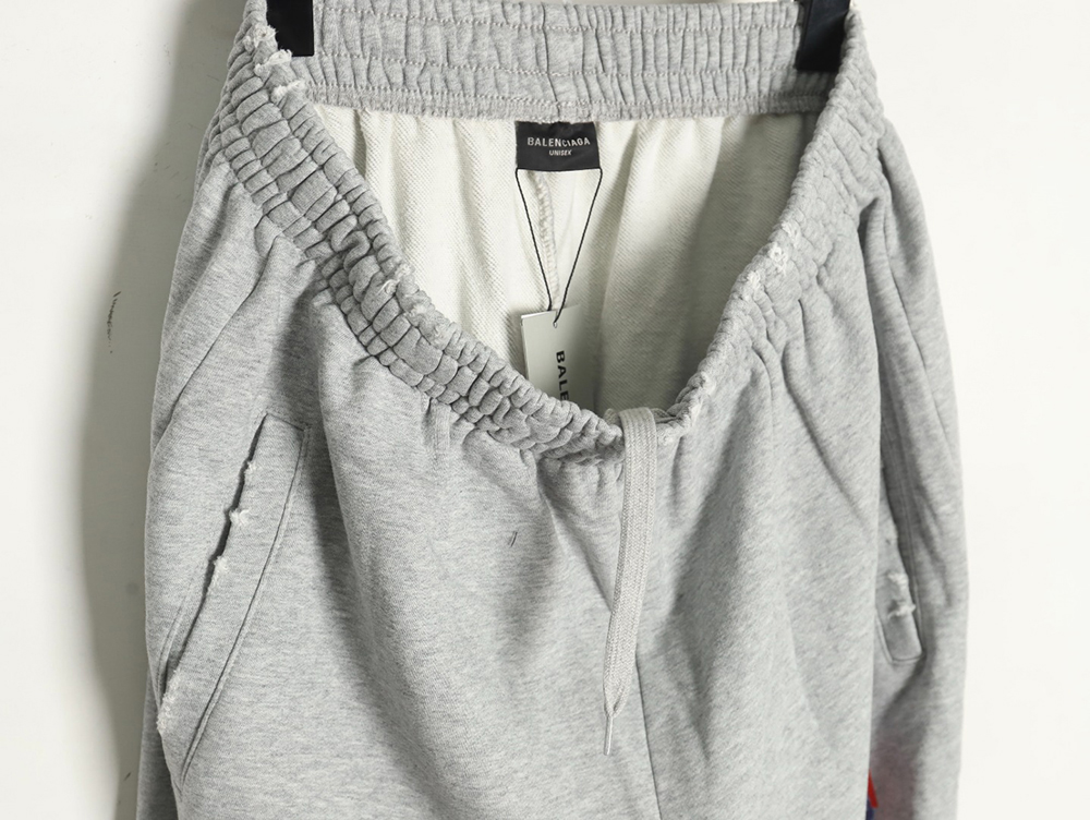 Ba*len*cia*ga earth pattern print distressed trousers