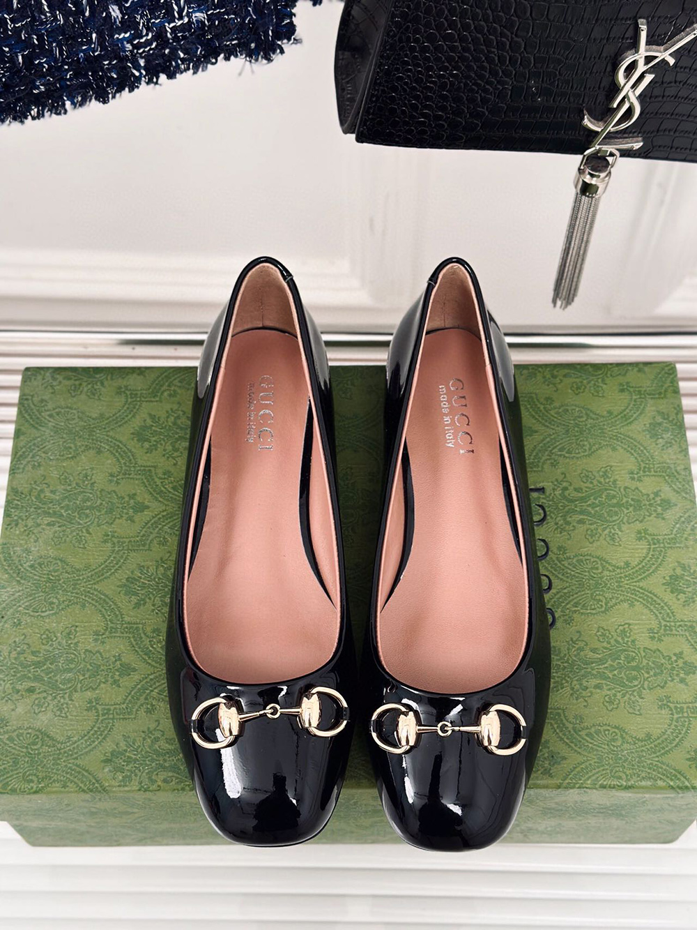 G*u*i horsebit black patent flats
