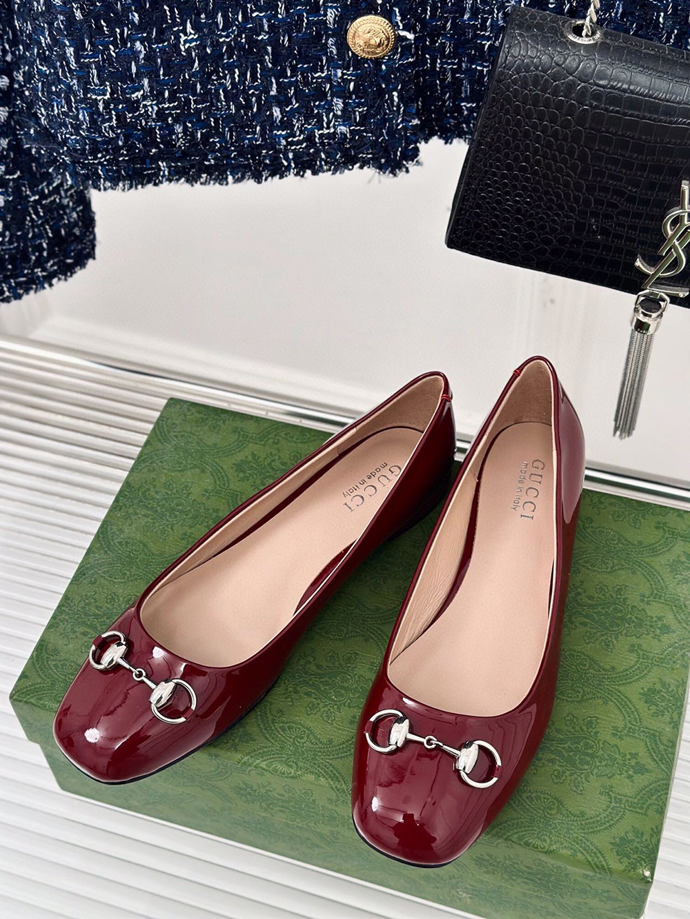 G*u*i horsebit black patent flats