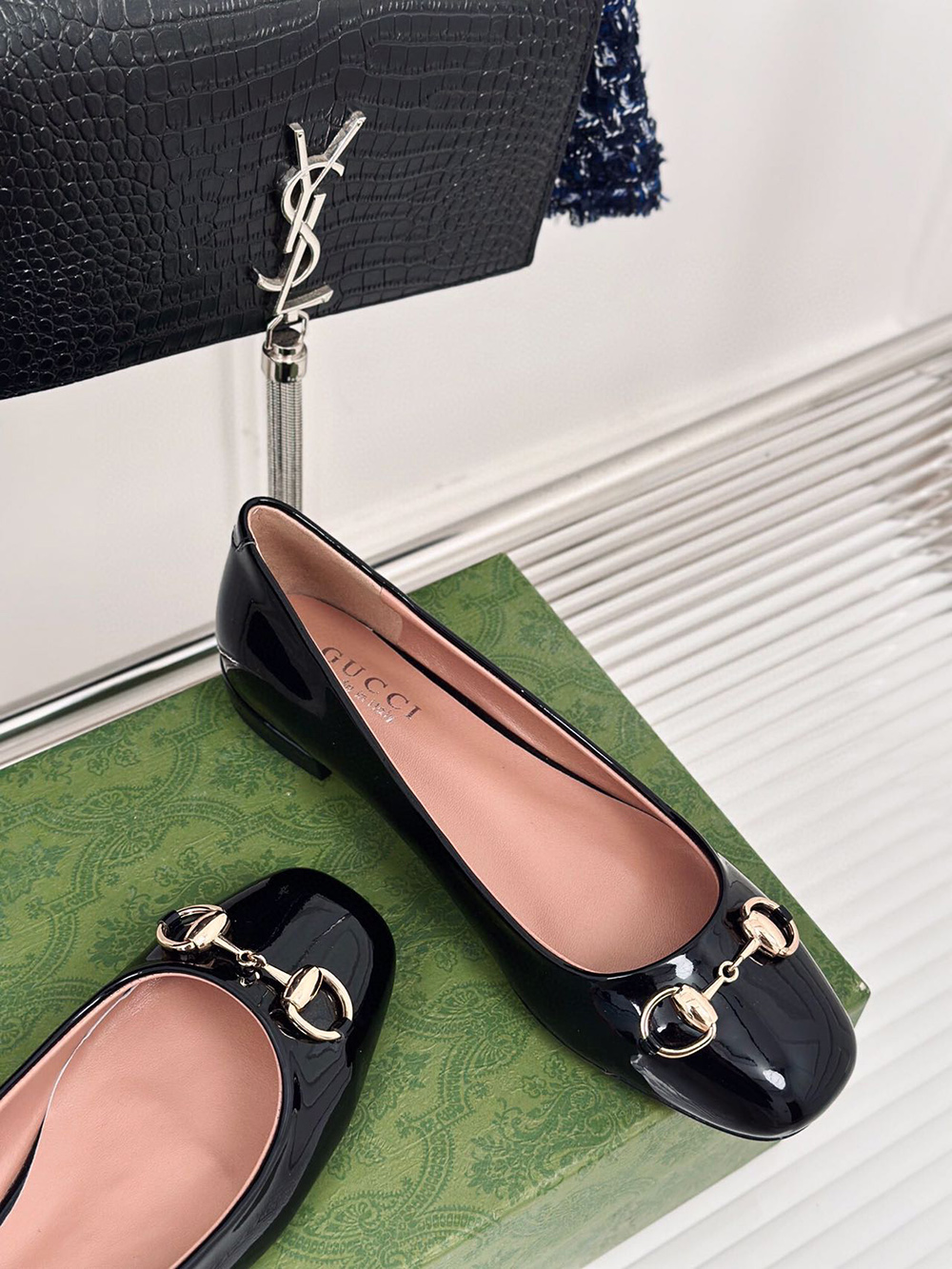 G*u*i horsebit black patent flats