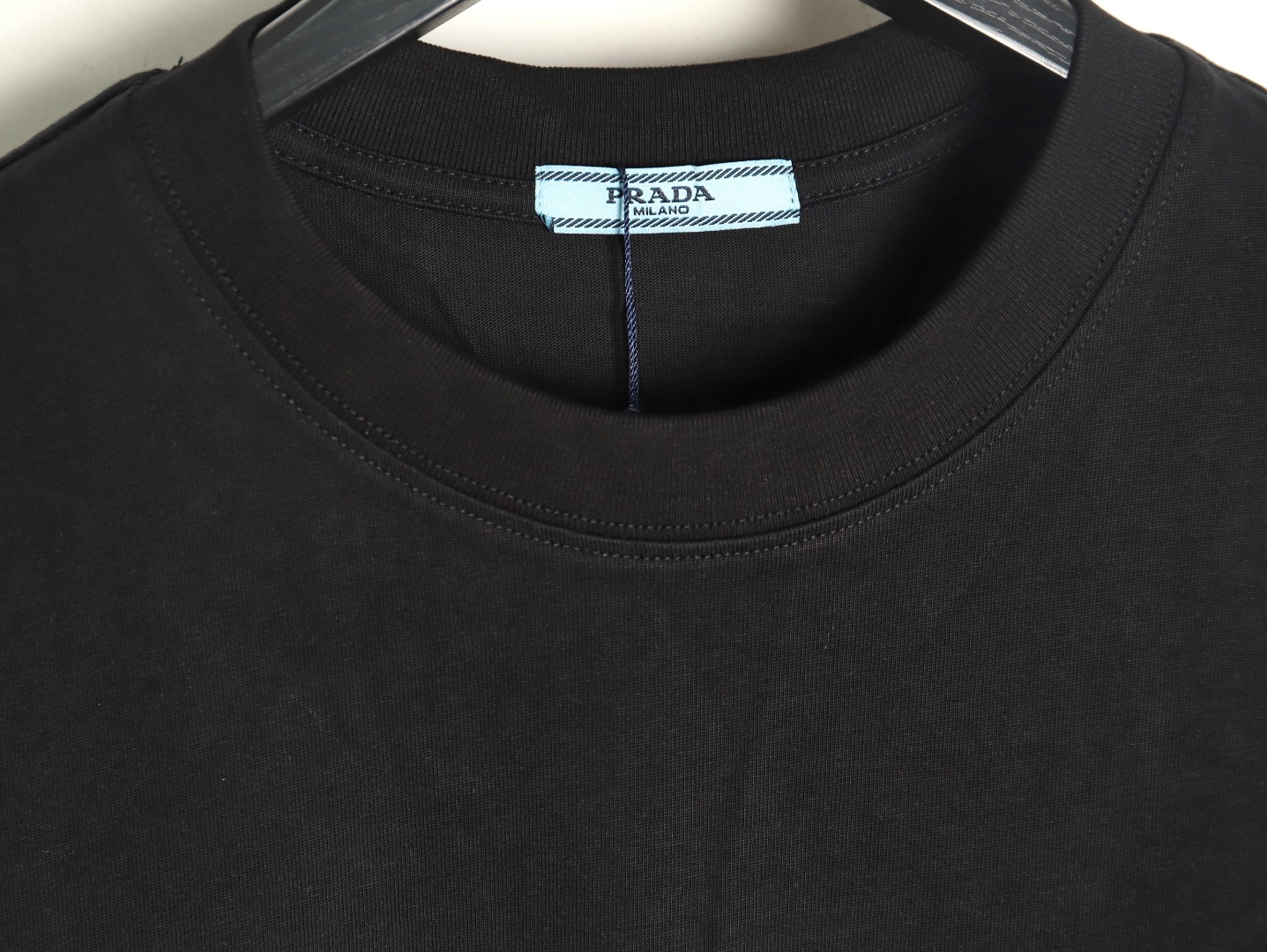 Pra*a triangle logo leather tag pocket short sleeves tsk1