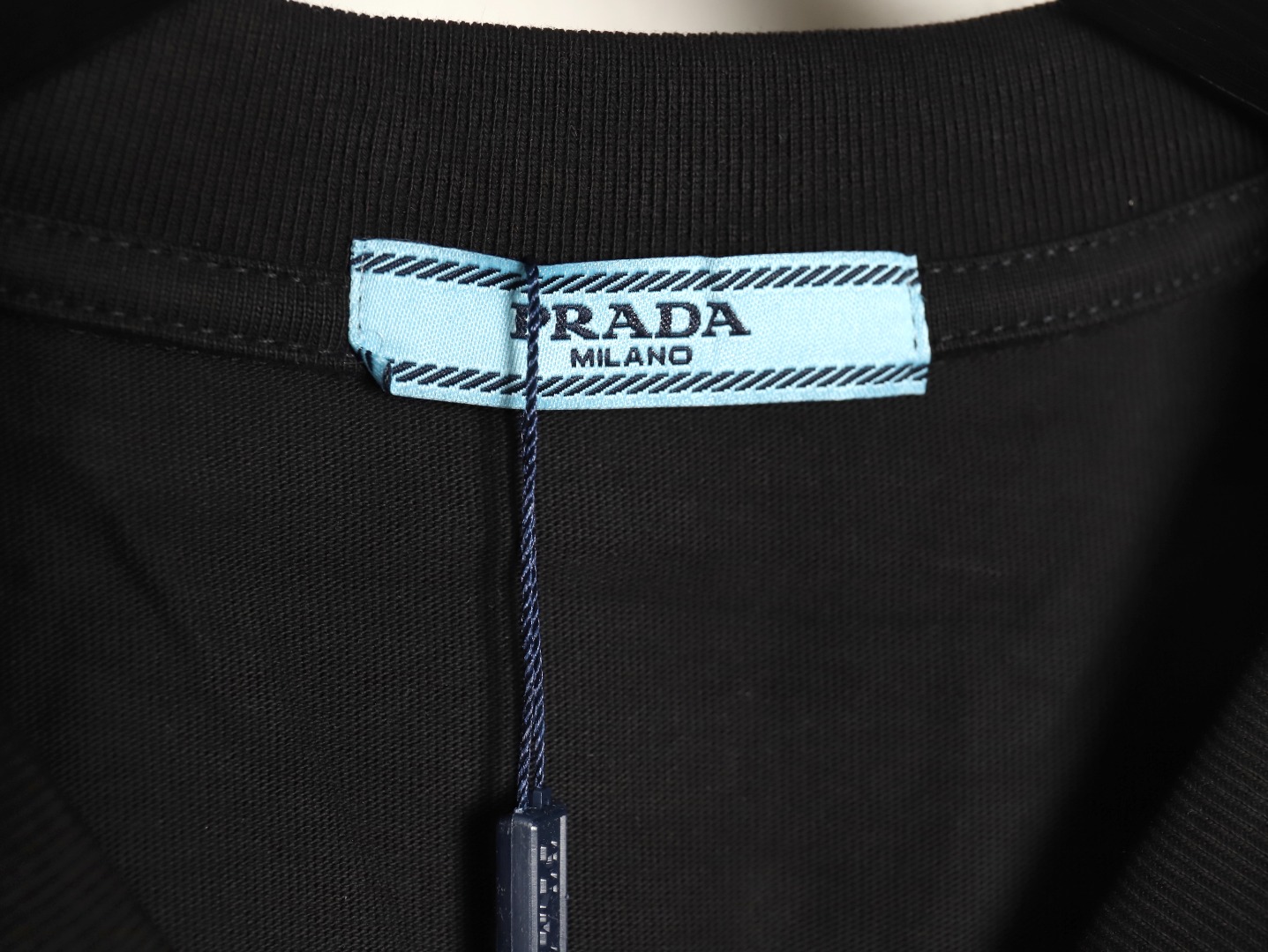 Pra*a triangle logo leather tag pocket short sleeves tsk1