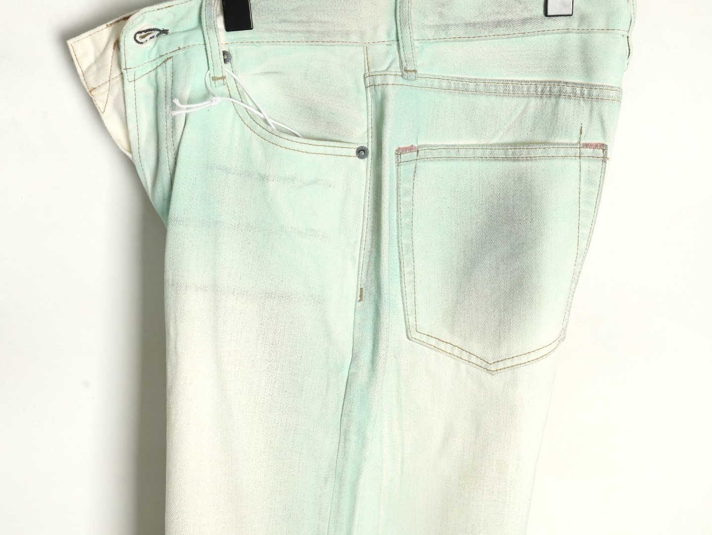 Acne studios irregular distressed handmade glow-in-the-dark jeans
