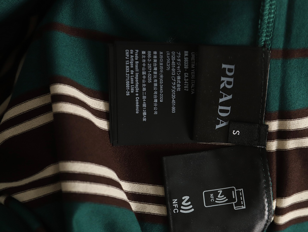 Pra*a green striped long sleeve polo shirt