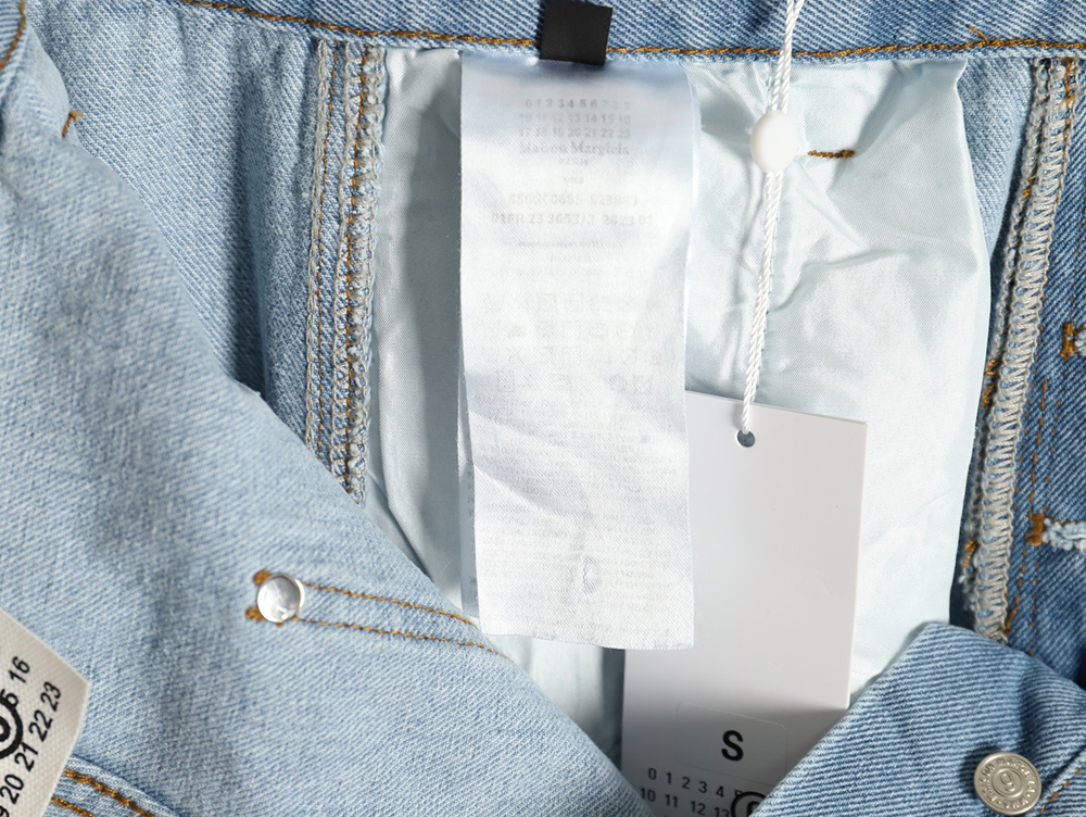 ma*s*n Ma*i*la distressed graffiti denim trousers