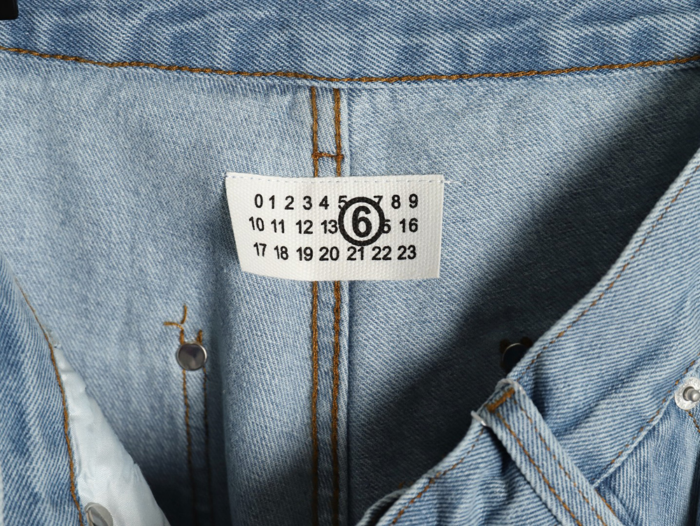 ma*s*n Ma*i*la distressed graffiti denim trousers